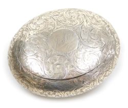 A Victorian silver tobacco or snuff box, of oval form, with foliate engraving, circular reserve engr