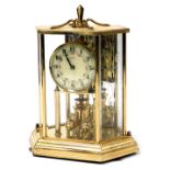 A Kundo brass 400 day anniversary clock, circular dial bearing Arabic numerals, Kilninger and Obergf
