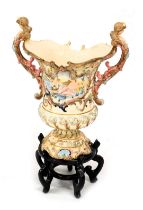 An early 20thC Austrian pottery vase, in the manner of Capodimonte, of twin handled campana form, re