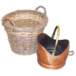 A Victorian copper coal scuttle, with brass swing handle, 29cm wide, together with a wicker log bask