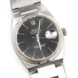 A Rolex gentleman's Oysterquartz Datejust stainless steel wristwatch, the circular black dial, with