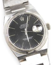 A Rolex gentleman's Oysterquartz Datejust stainless steel wristwatch, the circular black dial, with