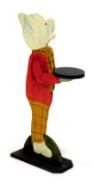 A Rupert the Bear painted wooden dumbwaiter, raised on a canted rectangular base, 86cm high.