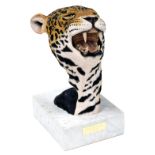 A plaster bust of a Night Stalker Jaguar, by O'neil Meredith, limited edition 1/50, raised on a marb