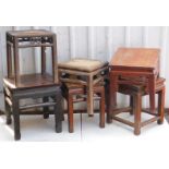 Six Chinese hardwood stools, one with a bamboo seat.