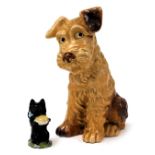 A Sylvac pottery figure of terrier, in seated pose, no. 1380, impress marks, 28cm high, together wit