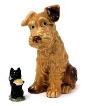 A Sylvac pottery figure of terrier, in seated pose, no. 1380, impress marks, 28cm high, together wit