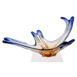 A late 20thC Murano blue to amber glass bowl, of fluted abstract form, 50cm wide.