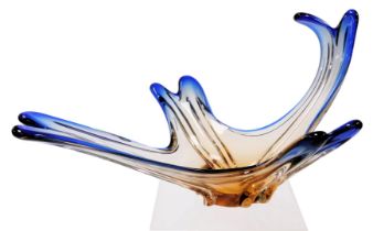 A late 20thC Murano blue to amber glass bowl, of fluted abstract form, 50cm wide.