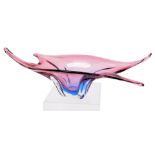 A late 20thC Murano pink to lilac glass bowl, of abstract fluted form, 52cm wide.