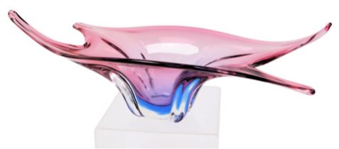 A late 20thC Murano pink to lilac glass bowl, of abstract fluted form, 52cm wide.