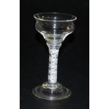A Georgian late 18thC pan top wine glass, raised on a double opaque helix stem