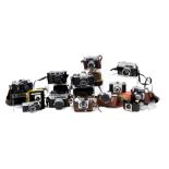 A group of vintage cameras, including a Minolta 7S, Asahi Pentax camera, Rank Aldis camera, and a Pr