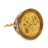 A George V gold half sovereign 1915, in a 9ct gold ring mount, size U, 8.3g.