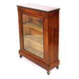 A Victorian walnut and inlaid pier cabinet, the glazed door enclosing two shelves, above a plinth ba