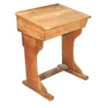 A Victorian oak child's school desk, the brass sliding ink recess stamped Illingworth Ingham and Com