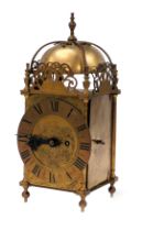 An early 20thC Camerer Cuss and Company brass cased lantern clock, rectangular engraved dial decorat