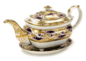 An early 19thC Derby porcelain teapot and stand, London shape, decorated in Manganese and gilt