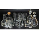A group of Dartington and other crystal glassware, including decanters and stoppers, water glasses,