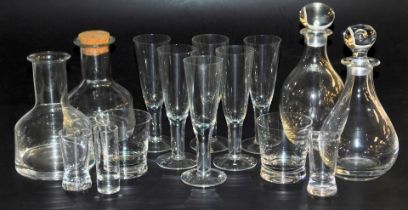 A group of Dartington and other crystal glassware, including decanters and stoppers, water glasses,