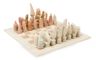 A small soapstone chess board with chess pieces, size of board 25.5cm x 25.5cm.