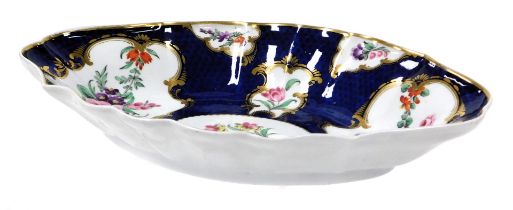 A late 18thC Caughley porcelain dessert dish, of fluted oval form, painted with reserves of sprays a
