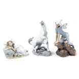 A Lladro Privilege unicorn, and two Lladro Privilege groups of fairies.