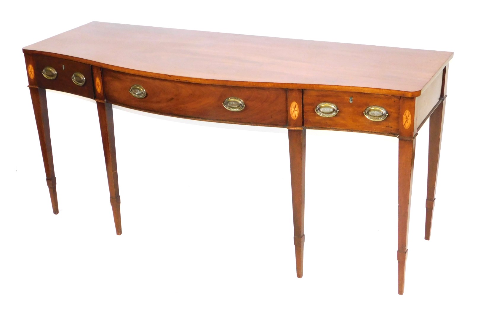 A George III serpentine mahogany serving table, with patera inlay, the top above one long flanked by