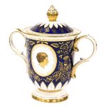 A Royal Crown Derby Fine English bone china twin handled urn with lid, decorated in blue, white and