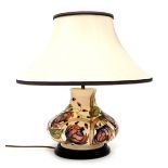 A Moorcroft Pirouette Breeze pottery table lamp, decorated against a cream ground, designed by Emma