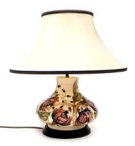 A Moorcroft Pirouette Breeze pottery table lamp, decorated against a cream ground, designed by Emma