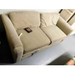 A two seater sofa with beige upholstery. Lots 1501 to 1590 are available to view and collect at our