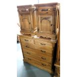A pair of pine bedside cupboards, of single drawer over single door, and a pine chest of two short o
