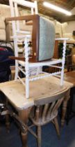 A white painted ladder back cane seated chair, without back, a pine kitchen table, and single pine c