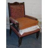A Victorian mahogany and upholstered parlour chair.