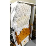 A single mattress, a pine single headboard, and a base unit. Lots 1501 to 1590 are available to vie