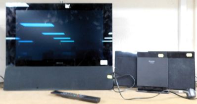 A Bang & Olufsen 22" wide screen TV, along with a Panasonic CD player.