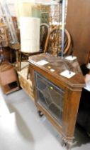 A varnished oak display cabinet, corner display with single leaded glazed door, a wine bucket on sta