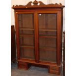 A top for a bureau bookcase, with two glazed doors, pediment over, four trinket drawers below.