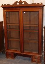 A top for a bureau bookcase, with two glazed doors, pediment over, four trinket drawers below.