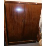 A early 20thC fitted compactum wardrobe.
