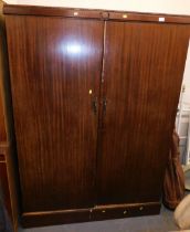 A early 20thC fitted compactum wardrobe.