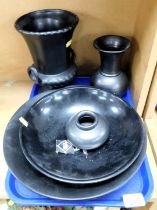 A group of black glazed pottery, including a Prinknash vase, Sylvac campana vase, and a fruit bowl,