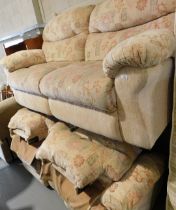 A two seater sofa and two electric reclining armchairs.