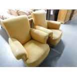 Two open armchairs, upholstered in orange/cream upholstery and a two seater sofa upholstered in beig