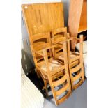 A dining table and four dining chairs, with rush seats. Lots 1501 to 1590 are available to view and
