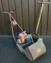 A Ransom's hand push lawn mower, Lioness mark 1, and a vintage Suffolk petrol lawn mower.