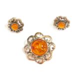 Imitation amber jewellery, comprising a brooch, with twist outer border, 2cm wide, and a pair of mat