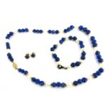 A lapis and cultured pearl jewellery set, comprising necklace with marquise shaped clasp, yellow met