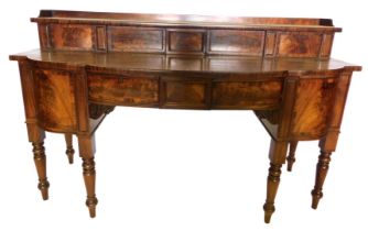 A George IV mahogany sideboard, the raised back with a gallery, above two sliding figured doors, the